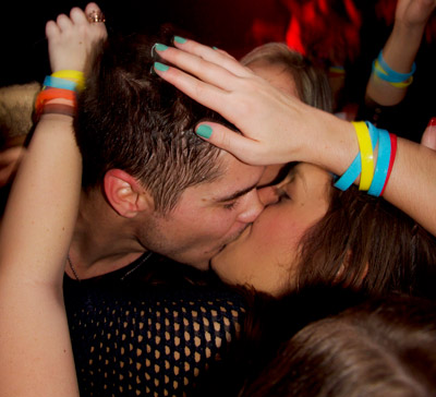 Dj and attendee kiss