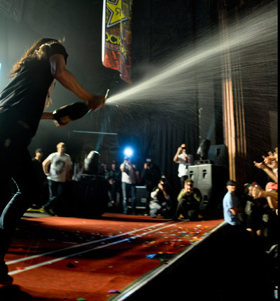 Steve Aoki sprays champagne over crowd